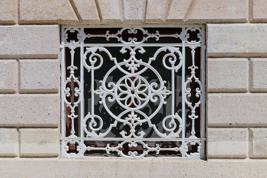 Forged architectural details - figured lattice painted white
