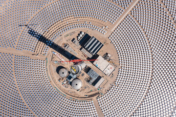 Aerial photo of molten salt tower solar thermal power plant under construction in Jiuquan, Gansu...