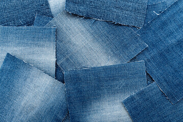 Texture from torn pieces of denim. Jeans texture. Material for sewing clothes