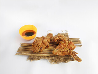 Fried Chicken with soy sauce sauce on a white background