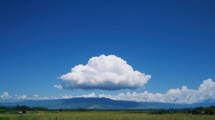 Serene Blue Sky with Majestic Cumulus Cloud Centered in the Frame