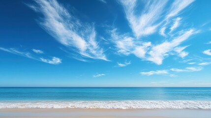 Fototapeta premium Tranquil Beach Landscape with Clear Sky and Wispy Clouds on Horizon