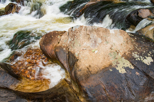 Water flows around rocks and boulders in the Linville Gorge, North Carolina