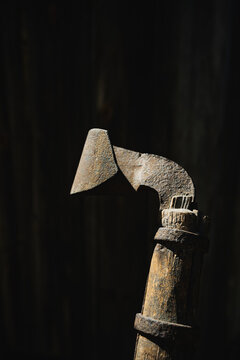 Closeup of a turpentine hack against a black background. The tool was used for scraping off pine bark from longleaf pine trees to make the sap flow.