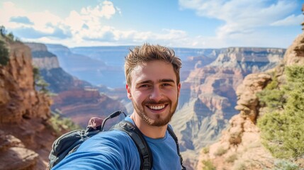 Naklejka premium A man poses for a selfie with a stunning vista behind him, blending his happiness with nature's beauty.