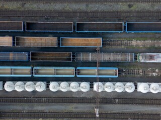 Aerial top-down view of freight trains wagons.
