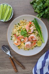 Fried rice with shrimps on a white plate