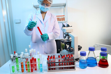 Scientists are testing medical drugs on a lab table.