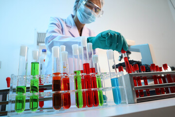 Scientists are testing medical drugs on a lab table.