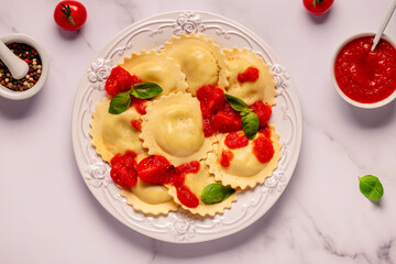 Ravioli with tomato sauce and basil