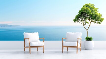 Outdoor terrace with two white chairs overlooking a serene ocean view and a potted tree under a clear blue sky.