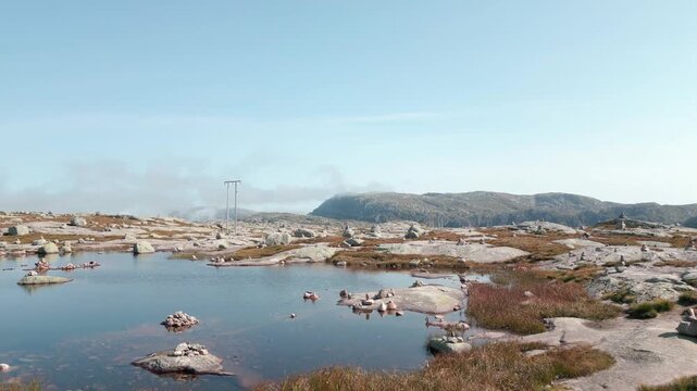 Beautiful nature with rock mounds on sunny day is summer close to Lysebotn town in Norway