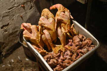 plucked carcasses of chickens and pigeons. poultry meat