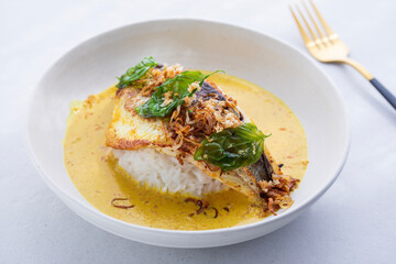 Indonesian curry with crispy sea bass and rice