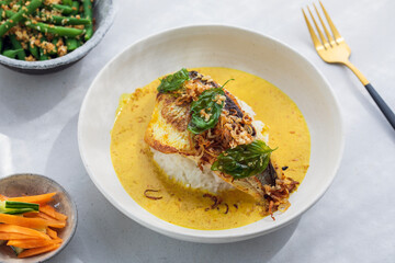 Indonesian curry with crispy sea bass and rice