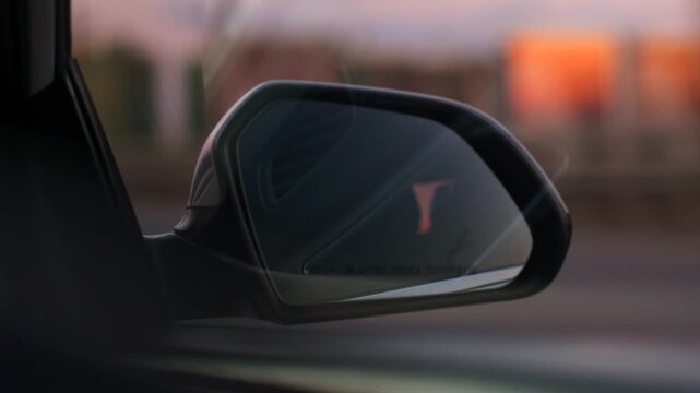car mirror.
Reflections in the rearview mirror