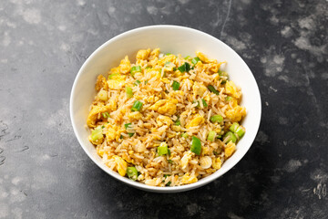 Egg fried rice with garlic, ginger, spring onion and soy sauce. Asian food