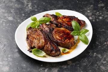 Grilled Pork Loin steaks in a white plate