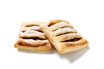 Homemade puff pastry pies filled with caramelized apples .  isolated on white background. 