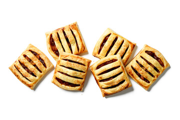Homemade puff pastry pies filled with caramelized apples . isolated on white background. top view