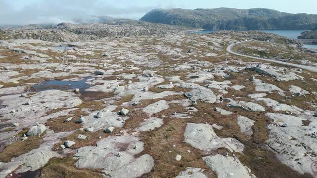 Beautiful nature with stone mounds on sunny day in summer close to Lysebotn town in Norway