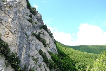 Picturesque view of rocky cliff in mountains