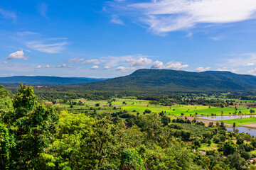 The background of green rice fields with large mountains and various kinds of trees provide shade and fresh air.