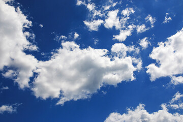 Blue sky with white puffy clouds