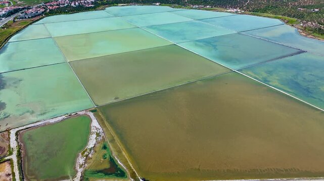 Extracting salt works from saltern pond or open salt evaporation ponds, aerial footage