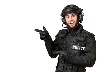 SWAT over isolated chroma key background surprised and pointing side