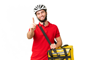Young delivery man with thermal backpack over isolated chroma key background showing and lifting a finger