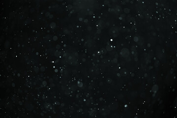 abstract real dust floating over black background for overlay