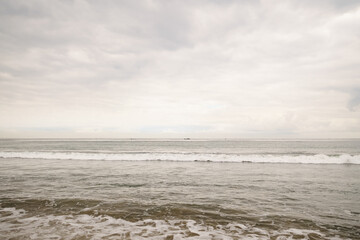 ocean waves on Santa Monica beach in cloudy november day