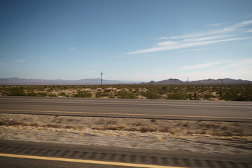 highway through Nevada desert in sunny autumn day