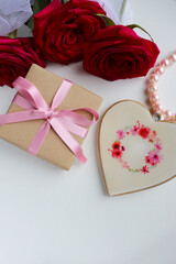 gift concept. beautiful gift boxes with bows and a bouquet of red roses