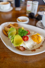A Delicious Breakfast Plate featuring a Fried Egg along with a variety of Fresh Ingredients