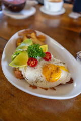 This delightful Brunch includes Fried Egg, Avocado, and Potatoes in a tasty meal