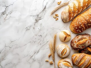 Obraz premium Freshly baked artisan bread assortment on a marble countertop