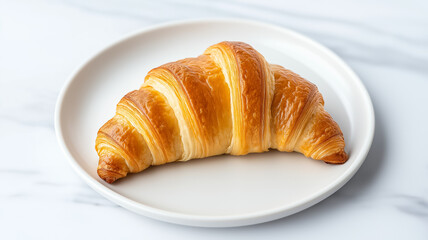 Closeup of a rice paper croissant with a delicate translucent texture golden brown edges and a slightly glossy finish placed on a minimalist white plate 