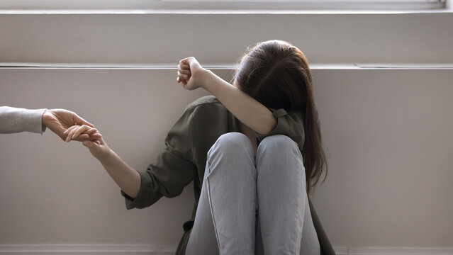 Upset teen accept loving parent help, holding mothers hands, get psychological support in difficult life situation, adolescence problems, bullying in school. Consolation, professional aid, disorder