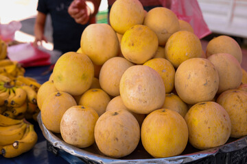Group of yellow fresh ripe melons on local bazaar