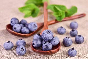 Blueberries in a wooden spoon.
Close-up