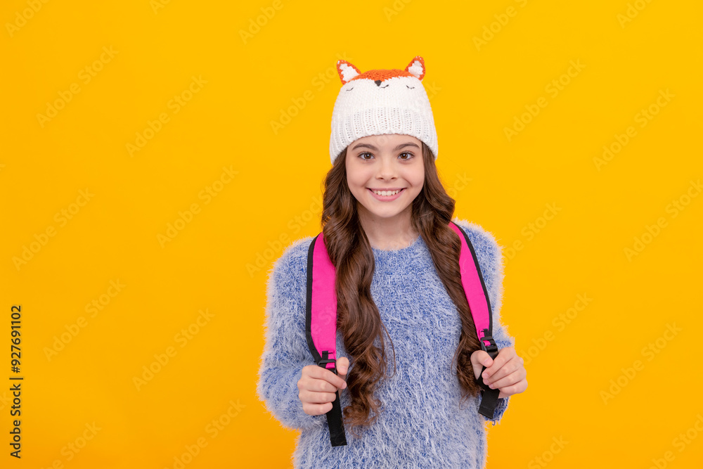 Poster back to school. teen girl in knitwear on yellow background. portrait of child