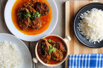 Fish fried curry. Indian style of cooking the fish fried curry with spices and finally garnished with green coriander. 
