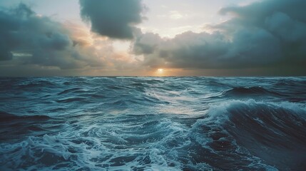 Ocean at dusk under cloudy sky
