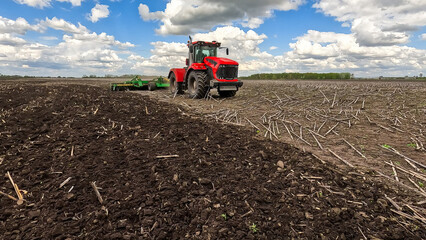 Fototapeta premium Versatile cultivator with disk, cultivate, harrow tools for secondary tillage