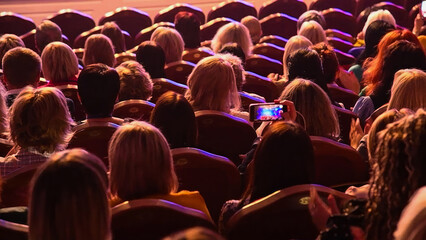 The people enjoying the singer on the stage