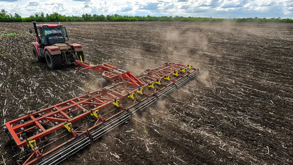 Versatile cultivator with disk, cultivate, harrow tools for secondary tillage