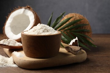Organic coconut flour, fresh fruits and leaf on wooden table