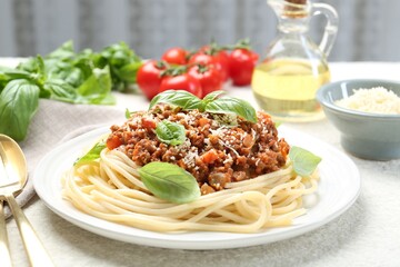 Tasty pasta bolognese served on white table, closeup